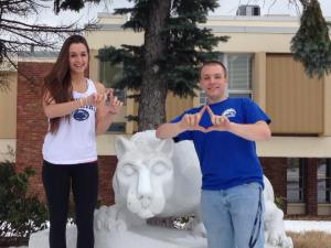 Brooke Churma and Alex Pedder pose with the Nittany Lion as they generate enthusiasm for the upcoming THON weekend. (Photo by Lauren Blum) 